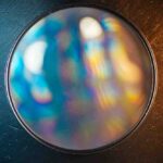 Close-up of The Blast Filter 138mm by SZ Filters showing rainbow diffraction