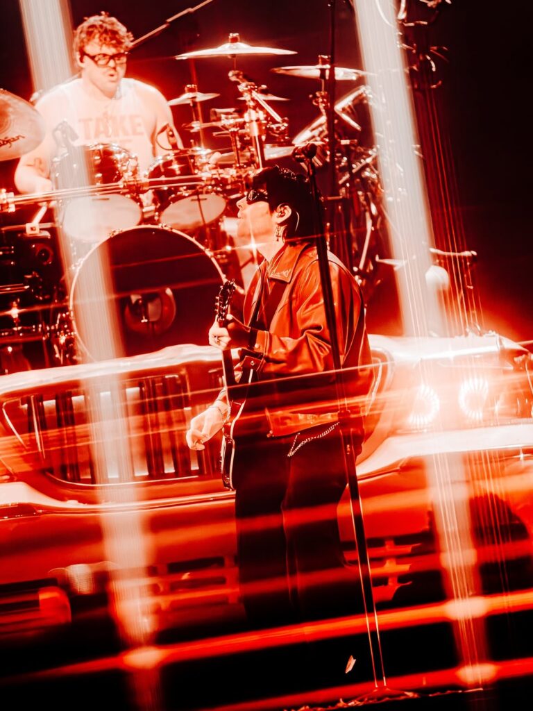 Concert photographer Zach Hood capturing a live performance using the SZ Filters Starlight X4 to create in-camera four-point starburst effects.