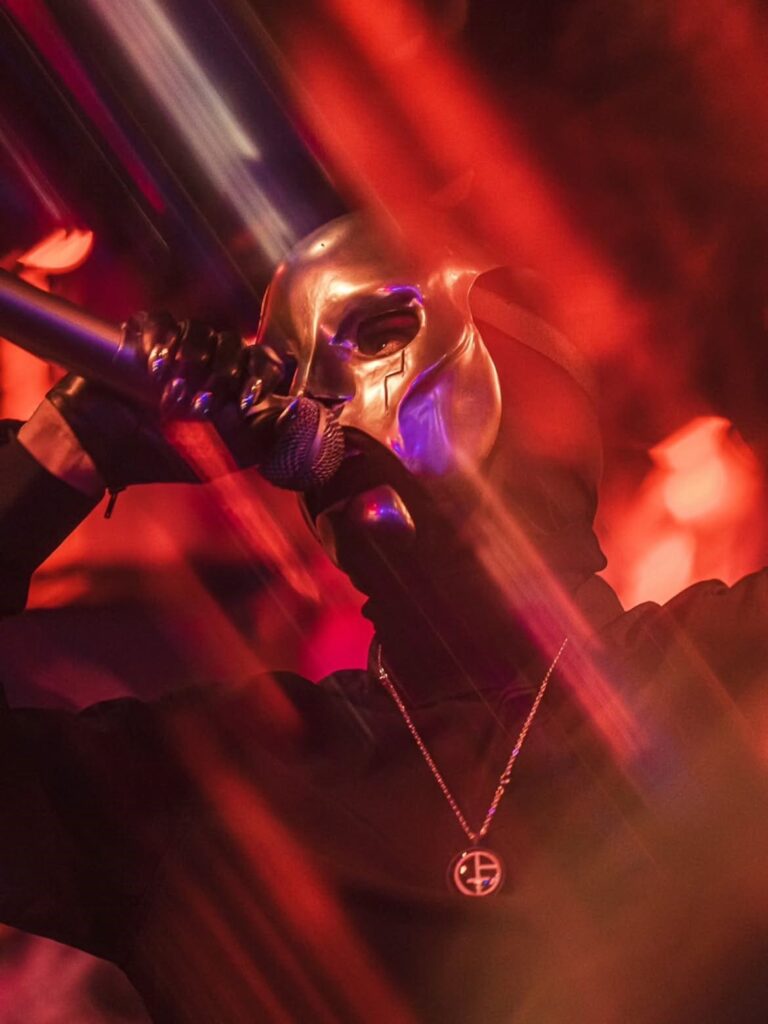 Pablo Salamone concert photography with red stage light and movement